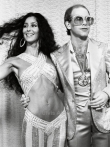 Cher and Elton John ,singers. 1975